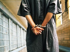 handcuffed-prisoner-in-jail-300x220.jpg