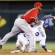 Kansas City Royals’ Alcides Escobar (2) beats the tag by Los Angeles Angels second baseman Howie Kendrick (47) during the sixth inning at Kauffman Stadium Thursday. Escobar was safe with a stolen base on the play. (AP Photo/Orlin Wagner)