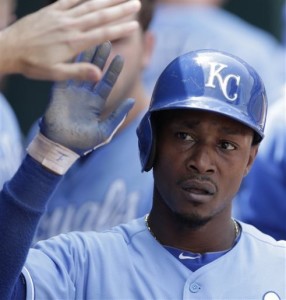 Kansas City Royals' Jarrod Dyson celebrates in the dugout after scoring on a ground out by Billy Butler during the third inning of a baseball game against the Oakland Athletics on Saturday, July 6, 2013, in Kansas City, Mo. (AP Photo/Charlie Riedel)