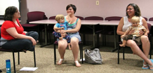 Members of the La Leche League International group in Lawrence share a laugh during a recent meeting at Lawrence Memorial Hospital. From left are Jenny James, Megan Peck and her son Ian, and Melinda Toumi and her son William Henry-Photo by Susie Fagan