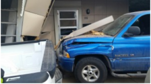 The pickup hit the house in the 100 block of West 20th on Friday. (courtesy photo by Hays Fire Department)