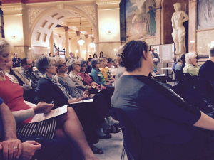 Photo by Jim McLean About 100 people attended a Statehouse rally on Wednesday to call attention to budget problems they believe are being caused by Gov. Sam Brownback’s tax cuts. 