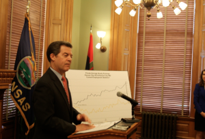 Photo by Andy Marso Gov. Sam Brownback says he’s “not too excited” about a proposed tobacco tax increase, but says it would have some positive health effects.