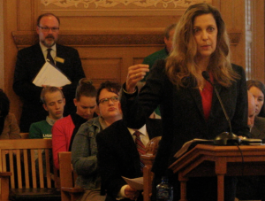 Photo by Dave Ranney Susan Mosier, acting secretary of the Kansas Department of Health and Environment, testified during a legislative hearing that Medicaid expansion would cost the state more than $100 million annually. But a recent study found that eight states where eligibility has been expanded have seen $1.8 billion in combined net savings and new revenue.