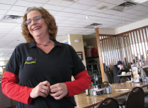 Photo by Jim McLean Sherry Calderwood, a waitress at a Topeka breakfast spot frequented by legislators and lobbyists, didn’t buy insurance through the Obamacare marketplace last year but did this year. “It’s great,” she said. “I’m not racking up hundreds of thousands of dollars worth of medical bills anymore."