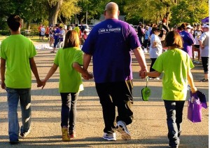 Cancer survivor JD Miller and his three kids walk in the 2014 Abilene Relay for Life. The Solomon man got financial assistance through the Elsie Brooks Cancer Fund, which also receives donations through the Wild Bill Hickok Rodeo.