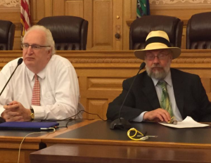 Photo by Jim McLean Gary Blumenthal, left, a former Kansas legislator and current member of the National Council on Disability, listens to testimony at a forum on Medicaid managed care, alongside Clyde Terry, who helped moderate the meeting Tuesday at the Kansas Statehouse.