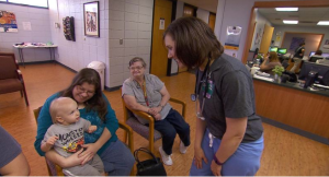 Dr. Julie Griffin greets patient Susan Walter and her family in the waiting room of the Community Health Center of Southeast Kansas in Coffeyville. JIM MCLEAN HEARTLAND HEALTH MONITOR