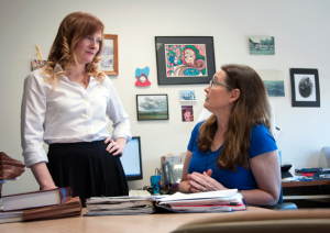 Photo: Recent KU Law graduate Abby West, left, discusses with clinical professor Jean Phillips last week’s favorable federal appeals court decision in a case that West handled as a student in KU’s Project for Innocence and Post-Conviction Remedies. photo-University of Kansas