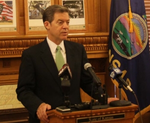 Photo by Andy Marso Gov. Sam Brownback said during a news conference Friday that rural hospitals should aim for innovation rather than Medicaid expansion to help their financial situations. 