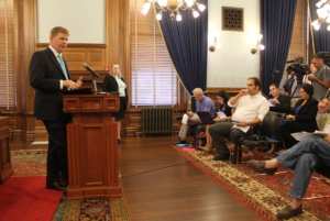 Photo by Dave Ranney Shawn Sullivan, Gov. Sam Brownback’s budget director, outlined $63 million in budget changes during a news conference Thursday at the Statehouse.