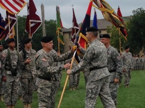 During the ceremony Maj. Gen. Paul E Funk II passed the 1st ID Colors to Maj Gen. Wayne W. Grigsby, Jr. symbolizing the passing of the command.-photo Fort Riley