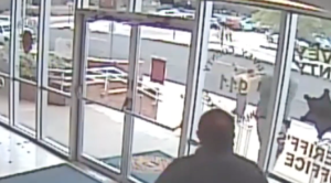 The suspect is confronted by officers