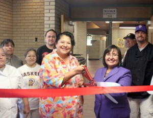 Dr. Venida Chenault, President, and Barbara Stumblingbear, Director of Food Services, with food services staff held a ribbon cutting ceremony to officially re-open Curtis Hall to students after all construction was completed.-Photo Haskell Univ.