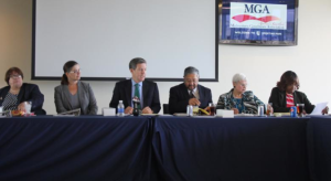 Photo by Andy Marso Gov. Sam Brownback, third from left, convenes the first meeting of the Governor’s Social Services Policy Council. The council met Wednesday at Sporting Park in Kansas City, Kan.