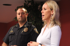 Photo by Dave Ranney Wade Borchers, left, a captain with the Lenexa Police Department, and Julie Solomon, chief strategic management officer at Wyandot Mental Health Center, discuss a proposal that would allow treatment facilities to hold people in crisis situations for up to 72 hours as involuntary patients. They spoke Wednesday at a meeting of the Kansas Mental Health Coalition