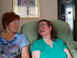 Kelli Johnsen, right, was diagnosed seven years ago with amyotrophic lateral sclerosis, also known as Lou Gehrig's disease. Kansas lawmakers are promoting bills intended to streamline the drug approva process for people like Johnsen. ANDY MARSO HEARTLAND HEALTH MONITOR