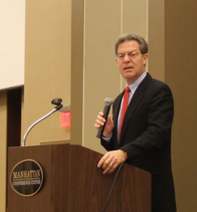 Photo by Andy Marso Gov. Sam Brownback opened a conference on the the future of water in the state by saying that the research and planning stages of the water vision are complete. “It’s time we make the tough decisions and move on forward,” he said. 