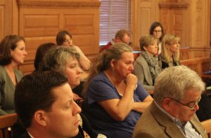 Cindy Poe, center in blue shirt, grandmother of a 10-month-old girl who died in July 2014 while in the care of homosexual caregivers, attended last week’s legislative hearing. She questioned why the committee focused on the caregivers’ sexual orientation rather than drug use. -photo by Andy Marso