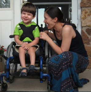 Photo by Ryan Reed/Special to KHI News Service Otis Reed, whose parents moved from Baldwin City to Colorado in search of a cannabis cure for the dozens of seizures he suffers every day, is slowly being weaned off ineffective pharmaceutical treatments and on to an oil derived from marijuana plants. Otis is shown here with his mother, Kathy Reed.