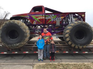 Trevor Keller (left) and his brother, Tyson, with owner and driver of "Over Bored", Jamey Garner (Photo by Terry Tebrugge/Salina Post)