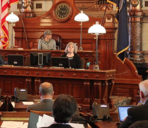 The Kansas Senate unanimously approved a bill Wednesday that would eliminate the inspector general position for the state's $3 billion privatized Medicaid system. Senate President Susan Wagle, seated at top beneath the clock, looks on during discussions. ANDY MARSO / HEARTLAND HEALTH MONITOR
