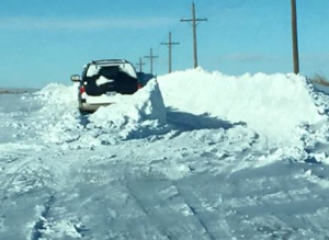 Vehicles abandoned in the snow are a causing problems for those working to clear roads in NW Kansas