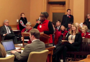 Maren Turner, director of AARP Kansas, speaks to a House committee in support of the Caregiver Act, which was introduced last year to the Kansas Legislature. The act would require hospitals to notify designated caregivers of patient discharge instructions, but hospital officials say they already face discharge regulations. CREDIT ANDY MARSO