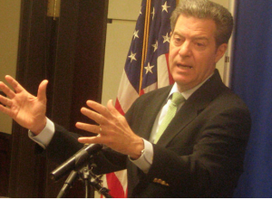 Gov. Sam Brownback vetoed a provision that would have reinstated mental health screenings after federal officials threatened to reduce the state's Medicaid funding. DAVE RANNEY / HEARTLAND HEALTH MONITOR