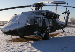 Kansas Army National Guard Soldiers cleared nearly three inches of snow from Black Hawk helicopters March 27 to prepare them for more reconnaissance and fire suppression missions throughout the day.-photo Kan. National Guard