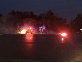 Officer directing traffic off of Tuttle Creek Blvd after after the October 5, fatal accident.