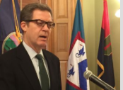 File Photo Gov. Sam Brownback signed a bill Monday that will allow insurance companies to avoid paying a privilege fee when they sell plans that cover only in-network care. Photo by KHI News Service