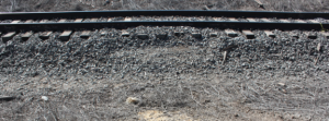 Perpendicular impression of tire tracks on north side of BNSF main track.-NTSB Photo