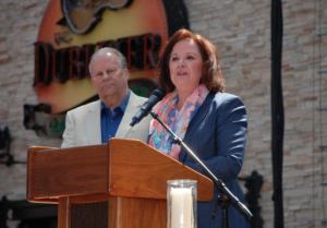 Roger Kemp, the father of Ali Kemp (for whom the annual award is named) joined U.S. Attorney Tammy Dickinson to present the award.