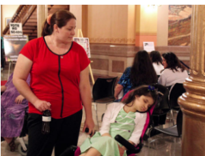 Tracy Robles of Wichita says her 7-year-old daughter needs a higher level of THC than 3 percent, so she and her family will move this summer to Colorado, which has legalized marijuana for both medical and recreational use. CREDIT ANDY MARSO / HEARTLAND HEALTH MONITOR