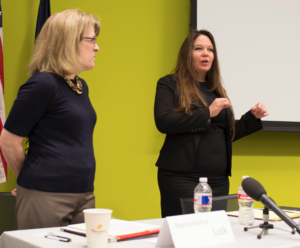 Photo by Amy Jeffries/KCUR Democratic Rep. Nancy Lusk, left, and moderate Republican Rep. Stephanie Clayton deliver a legislative update at the Johnson County Library in Overland Park.