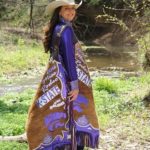 Brooke Wallace, the 2016 Miss Rodeo Kansas State Rodeo Queen, has a specially designed pair of chaps representing K-State and the Abilene rodeo. Photo by Amber Thompson.