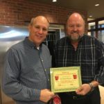 Tom Wilbur, President of Bank VI presents Pastor Barry Dundas with Hero of the Week Award.