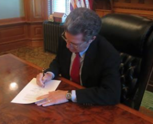 Brownback signed Substitute for House Bill 2001 ensuring that Kansas schools remain open.- courtesy photo