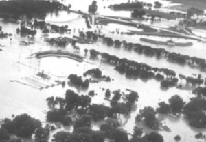 Aerial view of floodwaters in North Topeka. Cloverleaf on U.S. Hwy. 24 and Jayhawk Junior Motel in upper right -photo courtesy Kansas State Historical Society 