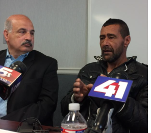 Syrian refugee Ahmad al-Abboud (right) tells his story through interpreter Fariz Turkmani during an April press conference in Kansas City. Al-Abboud and his family were hosted by Della Lamb Community Services, an outreach program of the United Methodist Church based in northeast Kansas City. photo by ALEX SMITH