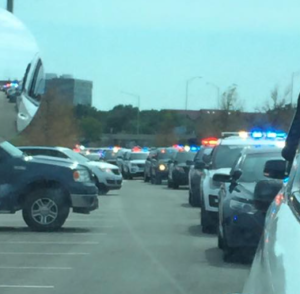 police vehicles lined up prior to Saturday's funeral- photo Ness Co. Sheriff