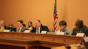 Photo by Andy Marso/KHI News Service Rep. Dan Hawkins, center, and other members of the Robert G. (Bob) Bethell Joint Committee on Home and Community Based Services and KanCare Oversight questioned a state contractor about ongoing backlogs in the Medicaid application process. -