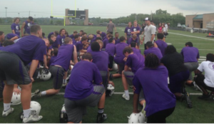 Photo by Andy Marso/KHI News Service Mike Zegunis, football coach at Blue Valley Northwest High School, addresses his team during a recent practice at the Overland Park school. Kansas high schools are starting the second year under new rules that limit full-contact football practice. Players aren’t allowed to go all-out until the fifth practice. Once games start, full-contact practices are limited to an hour and a half, and contact isn’t allowed the day after games. -