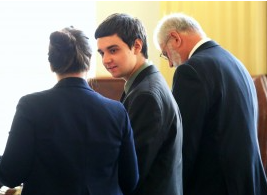 Defense attorney Lynn Burke, left, talks to Sam Vonachen with defense attorney John Henderson, right, during Vonachen’s trial at the Reno County courthouse Monday morning.-pool photo Hutch News