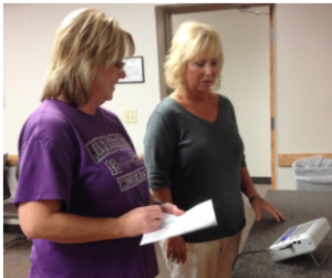 Salina, Kansas, resident Janis Wearing, right, weighs in as nurse Shari Sutton records the data. Wearing is taking part in a University of Kansas Medical Center weight management study called RE-POWER.
