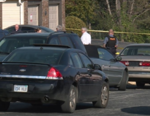 Police investigators on the scene of Monday's fatal shooting- photo courtesy KMBC