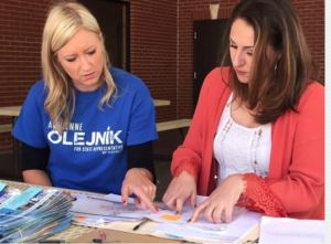 Photo by Jim McLean/KHI News Service Adrienne Olejnik, left, plans a day of door-to-door campaigning with Michele Sizemore, her campaign manager. 