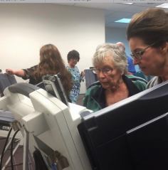 Photo by Jim McLean/KHI News -Trying out an electronic voting machine at a training for poll workers in Kansas