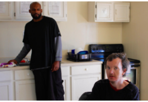 Roy Alcorn, right, was discharged a month ago from Osawatomie State Hospital so he could receive home and community-based services in Topeka from Equi-Venture Farms. Now he lives with a host, Donald “Mitch” Mitchell, left, and another person with a developmental disability. CREDIT ANDY MARSO / HEARTLAND HEALTH MONITOR